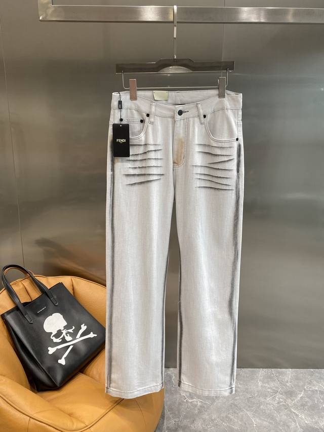 Fendi jeans, made of light grey denim, feature a unique wash process that gives