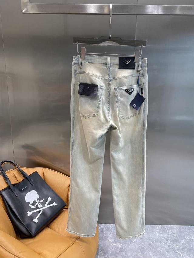 Prada jeans, a simple and sophisticated summer choice. Light-colored denim with