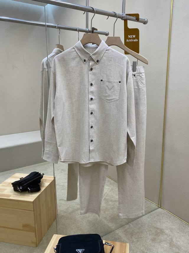 is featuring the Prade25Ss new fabric triangle micro-label suit, a 70% Tencel, 3
