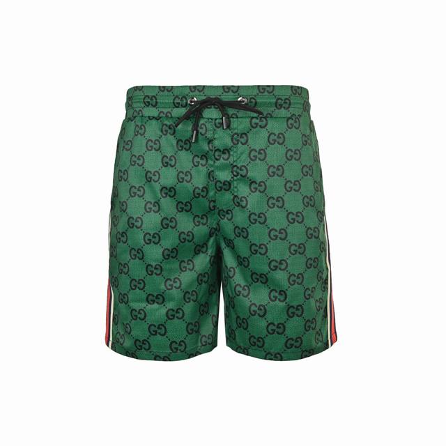 Gucci 25Ss beach shorts with all-over monogram print and side webbing. Made of h