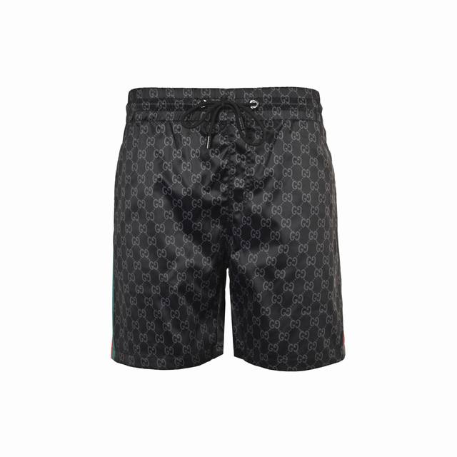 Gucci 25Ss beach shorts with red and green monogram print on the sides. Made of