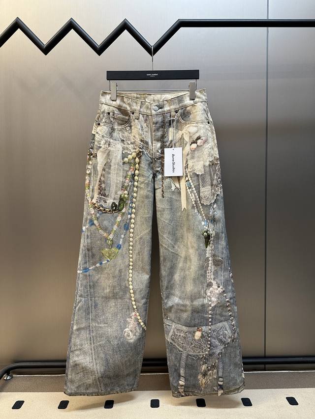 Acne lace print jeans feature a relaxed straight-leg fit with a low rise, wide l