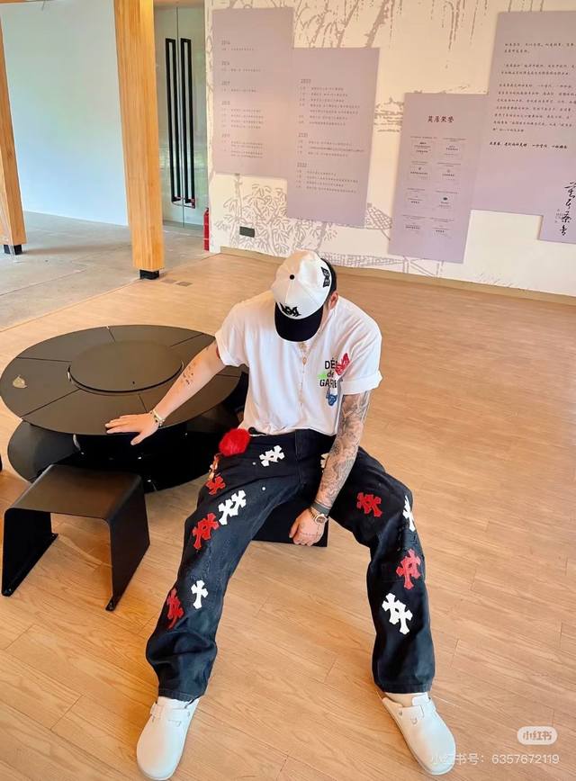 Model photo Chrome Hearts black lumberjack jeans with red and white leather elem
