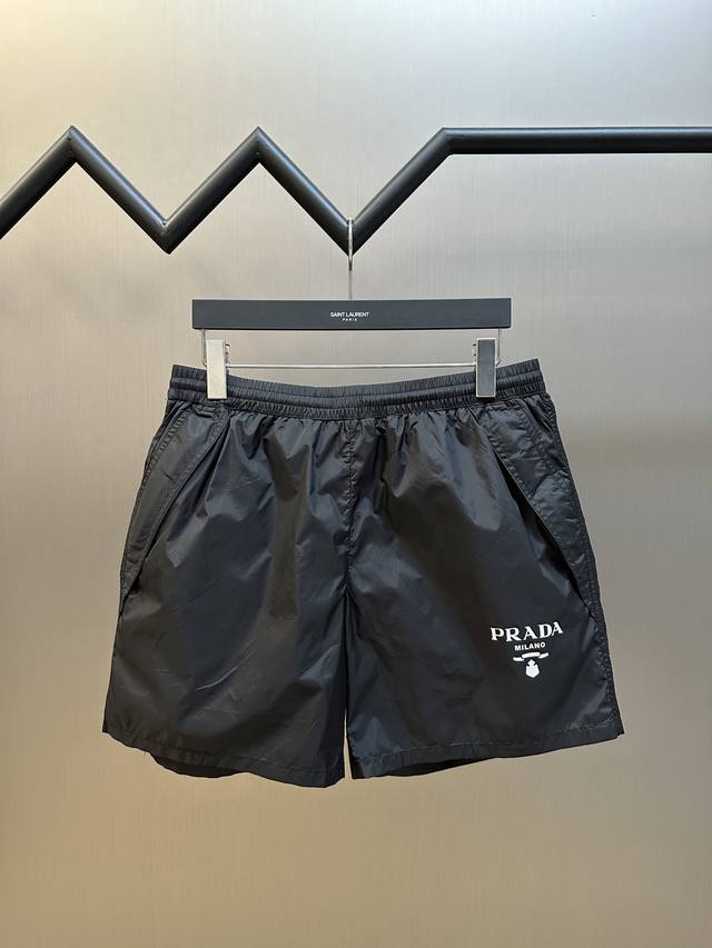 Prada printed nylon shorts are custom-made from recycled nylon fabric for a fres