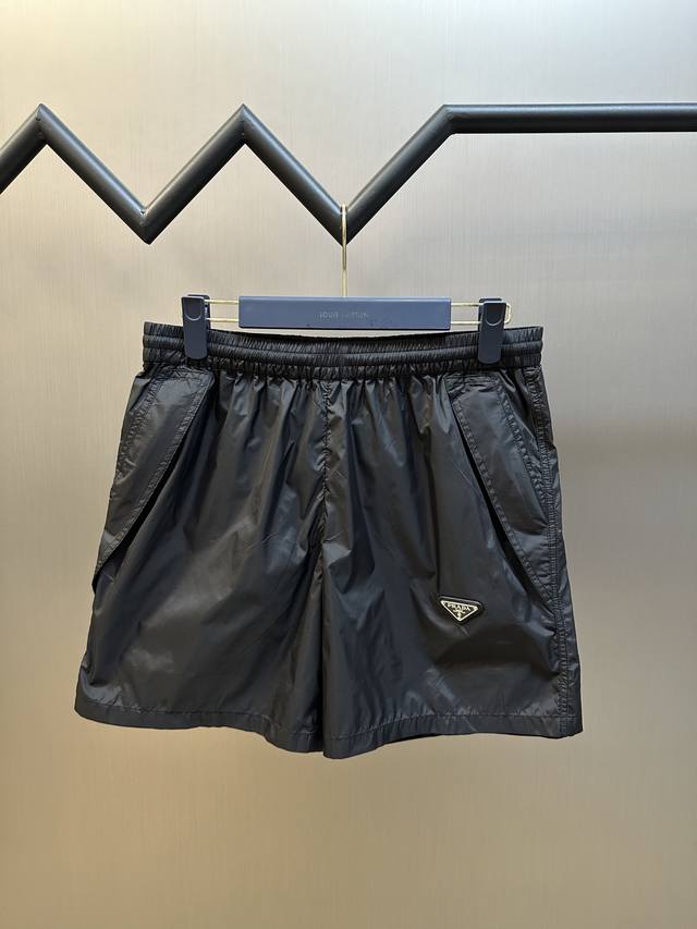 Prada triangle logo nylon shorts. Made of recycled nylon fabric, with a deep bla