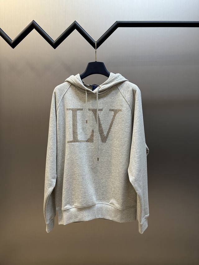 Lv Rhinestone Hoodie. This hoodie features a fleece-lined cotton knit and a ribb