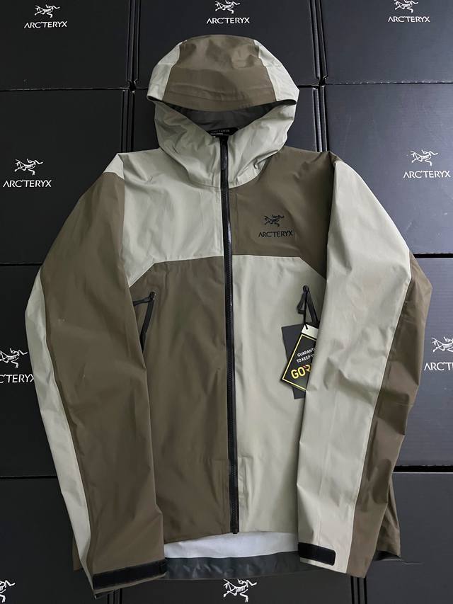 tabs, and Zip-In compatibility are included. The Arc Teryx logo is embroidered o