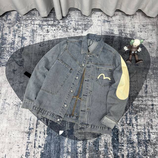 This premium, original Evisu Fushen washed denim jacket with a large, slanted M