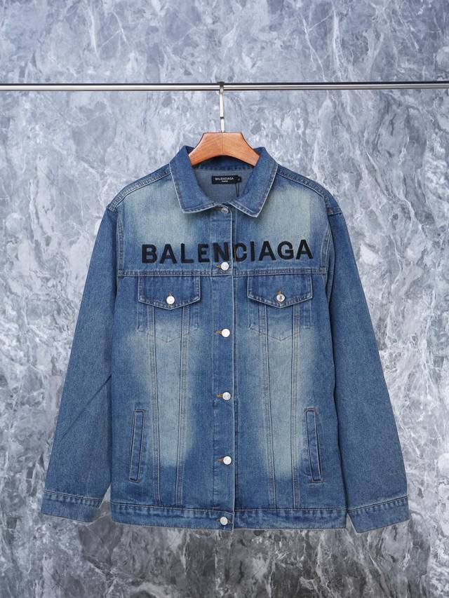 Balenciaga blue denim jacket with letters on the chest. Balenciaga's new denim j
