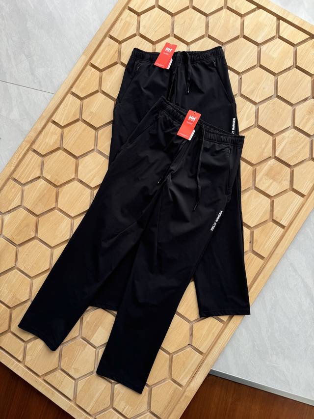 Hellyhansen's slanted zippered pocket design and reflective strips on the back l