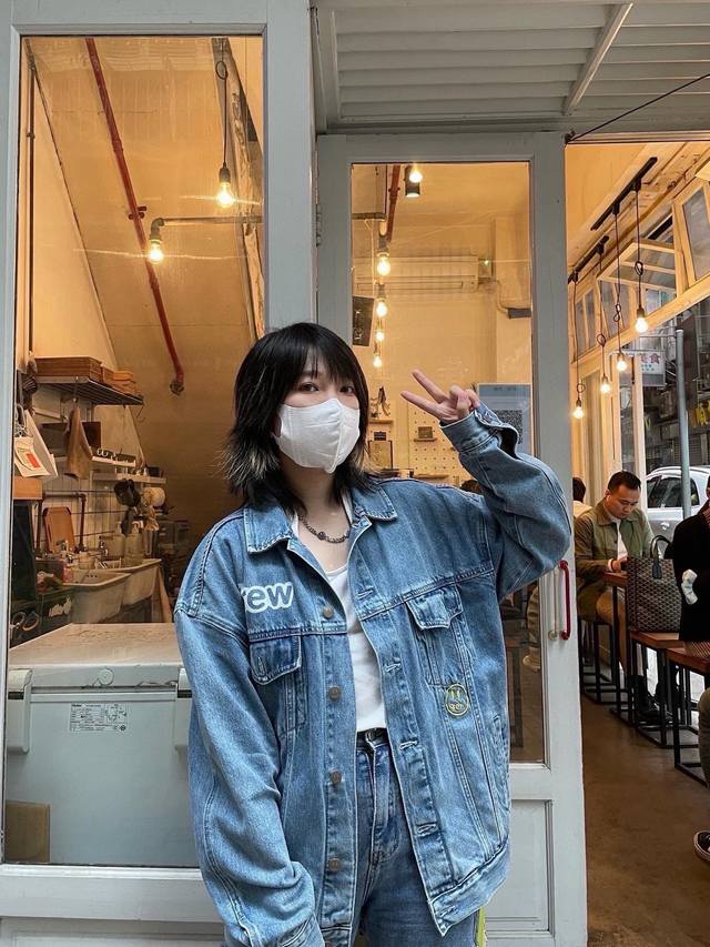 Drew House Trucker Jacket is a washed and distressed denim jacket with a patchwo
