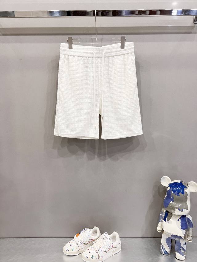 Givenchy custom jacquard shorts. Classic brand logo, all-over jacquard craftsman
