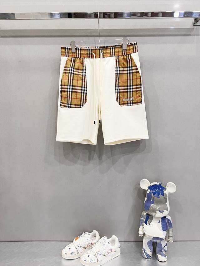 Burberry custom-made space cotton shorts with plaid elements, logo patchwork on