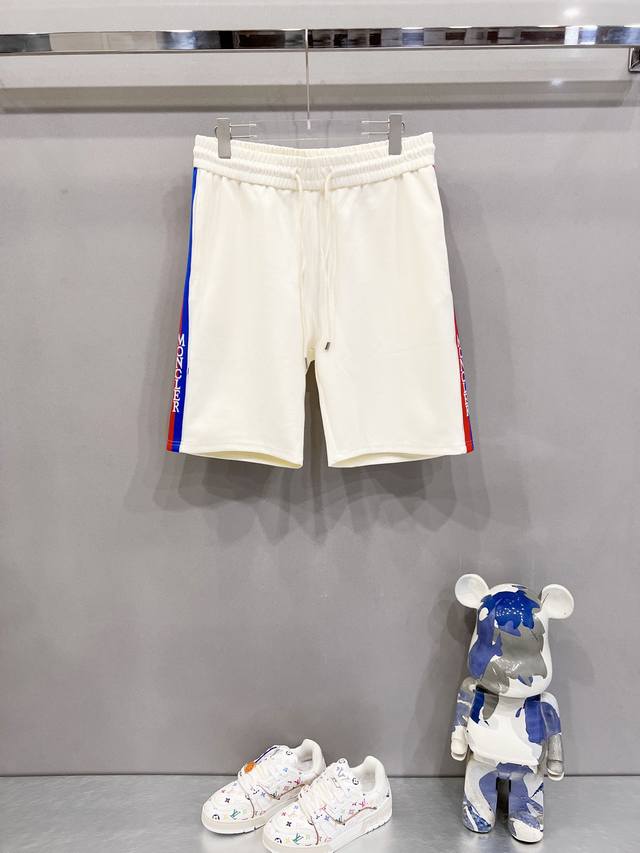 Moncler custom-made space cotton shorts with logo webbing and nylon pockets. Fea