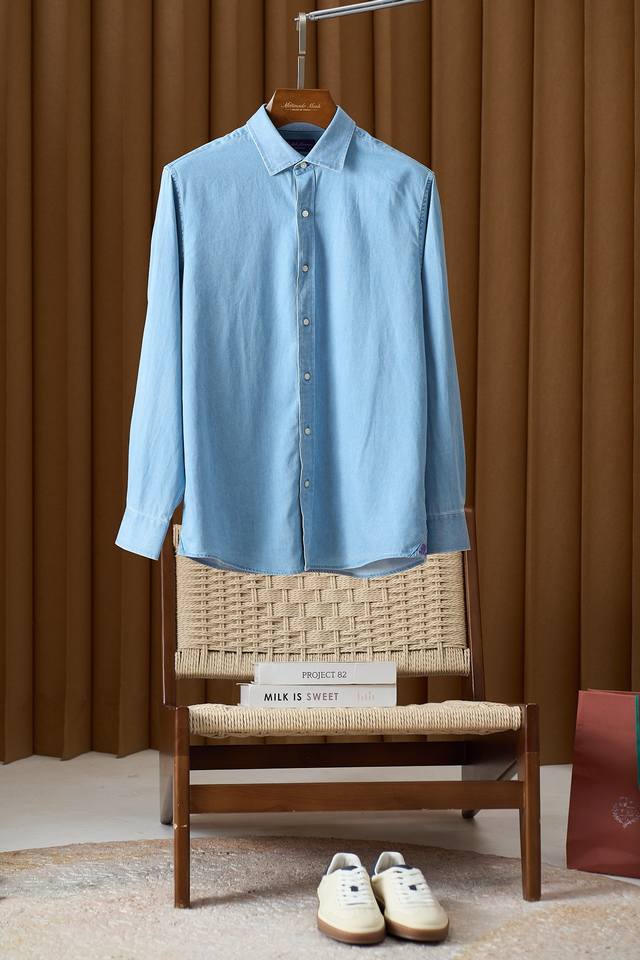 The timeless charm of the Ralph Lauren embroidered logo light blue denim shirt.