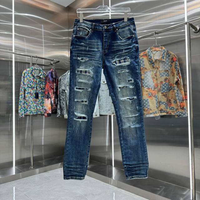 D Amiri ripped street style slim-fit stretch jeans. Color: blue. Sizes: 30, 32,