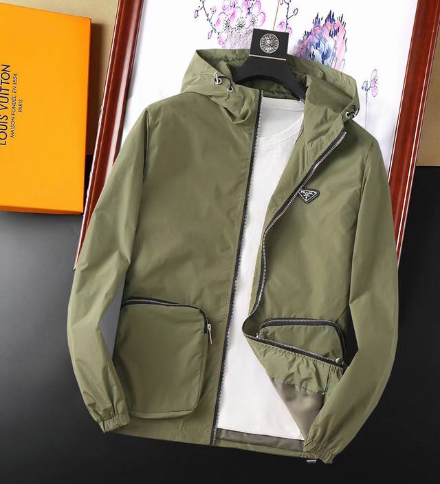 Prada's new men's jacket for spring 2025, featuring the original three labels an