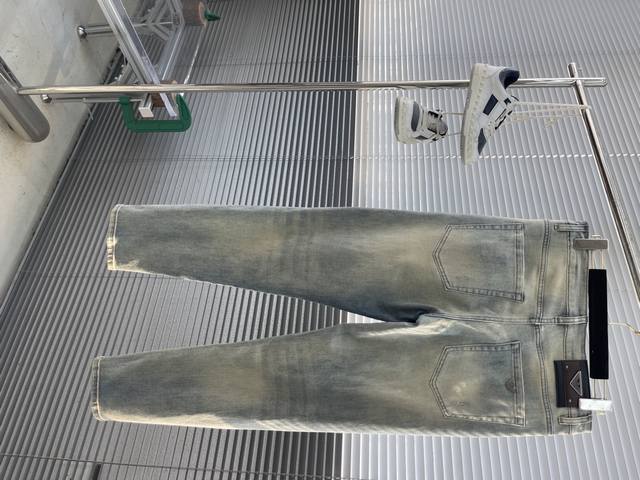 Ea Amani 25Ss new spring and summer jeans with brand metal badge design on the b