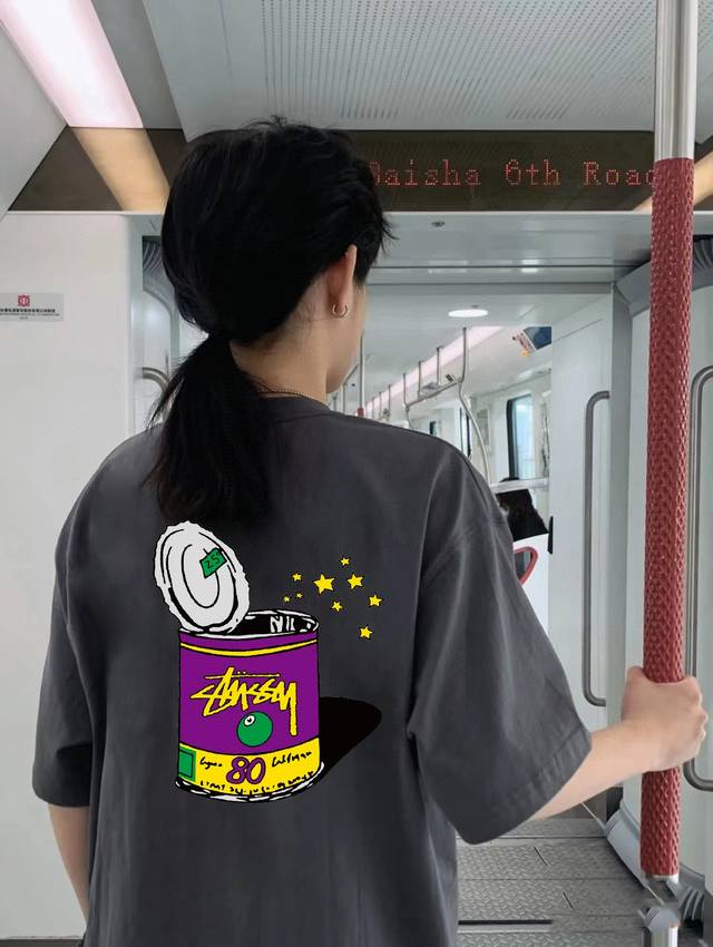 High-quality Stussy collaboration short-sleeve top featuring a large front and b