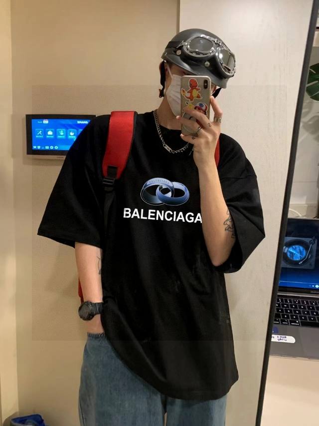 High-quality Balenciaga collaboration with the classic double-ring logo. Unisex