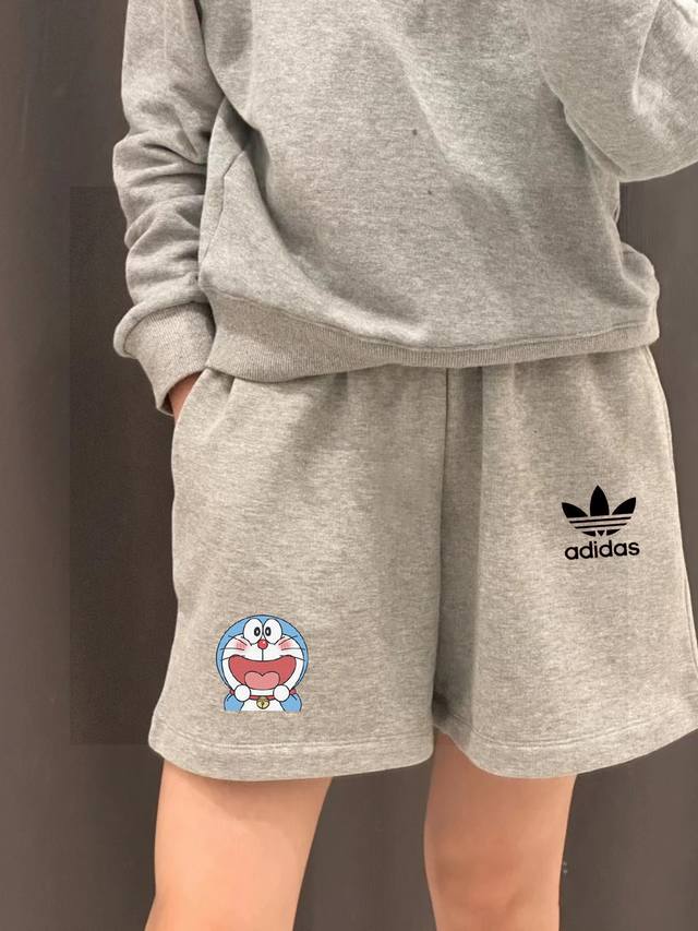 Adidas' latest co-branded Trefoil Doraemon print shorts for couples. Don't say y