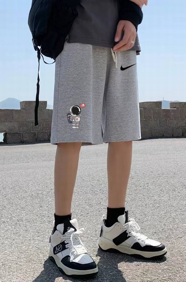 Nike counter simultaneous co-branded shorts with astronauts landing on the moon