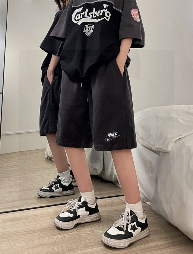 Nike's latest basic hollow letter print shorts for couples of both sexes. Don't
