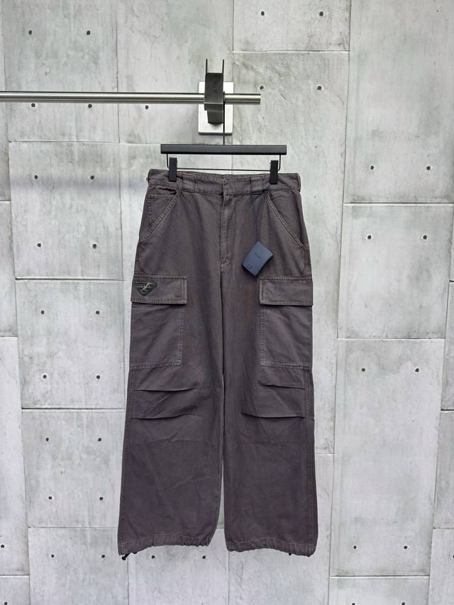 Prada distressed triangle logo trousers. Craftsmanship: Customized coarse washed