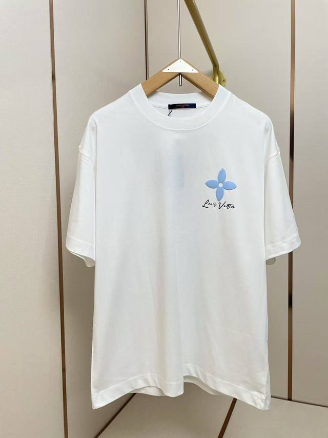 LV's new foam floral T-shirt features a striking yellow four-petal flower patter