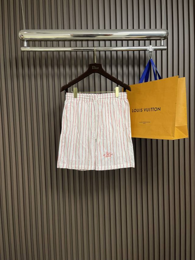 Dior striped satin shorts, embellished with ivory and contrasting stripes, pay t