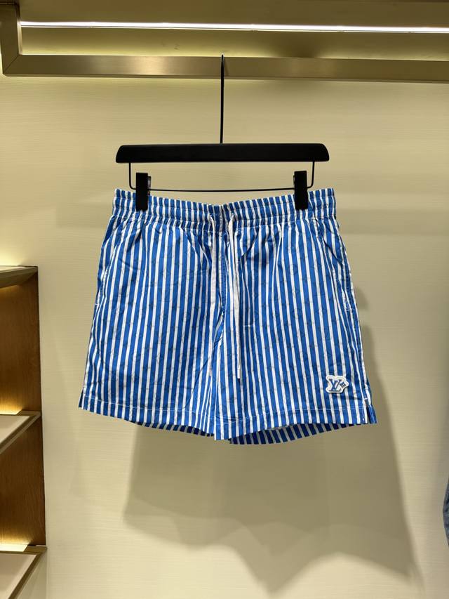 Lv Blue Striped Beach Shorts. These beach shorts feature an all-over Monogram pa