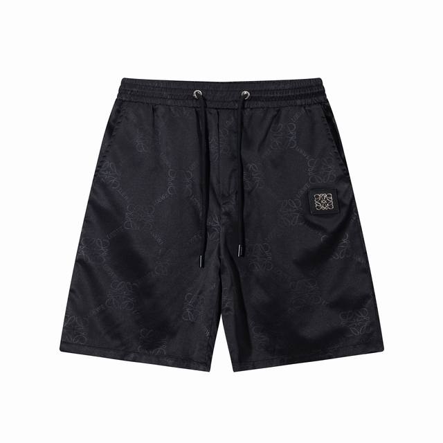 Loewe's new quick-drying beach shorts, custom fabric and crafted logo. The tight