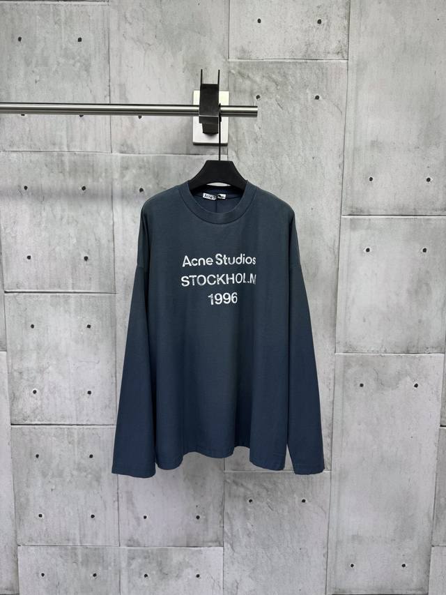 Acne Studios 1966 mud-dyed, washed, and distressed long-sleeved top. Made from u