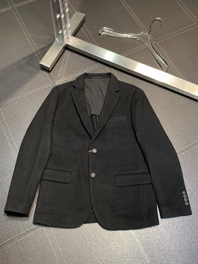 a Prada exclusive new blazer. This simple, casual blazer is made from imported,