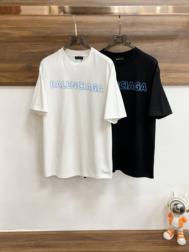 features Balenciaga's exclusive new spring collection, a stylish, casual crew-ne