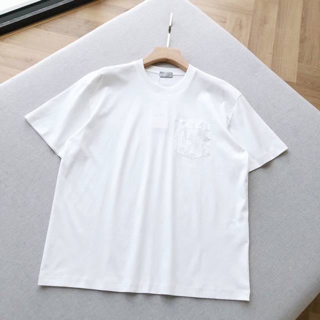 A Di** short-sleeved couple's t-shirt with subtle embroidery and pockets. This D