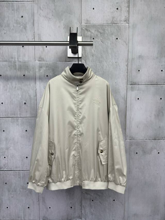 Miumiu's embroidered letter patch jacket is made of light brown cotton knit fabr