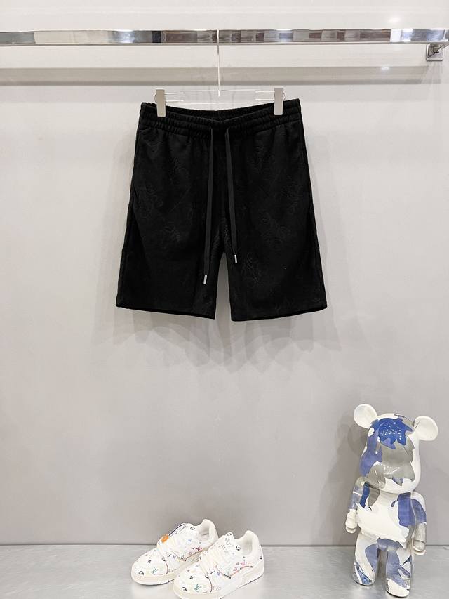 Kk Loewe custom jacquard shorts with all-over floral and dark pattern totem logo