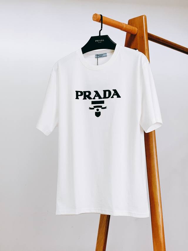 Prada's new 2025 Spring/Summer embossed logo T-shirt is in impeccable condition,