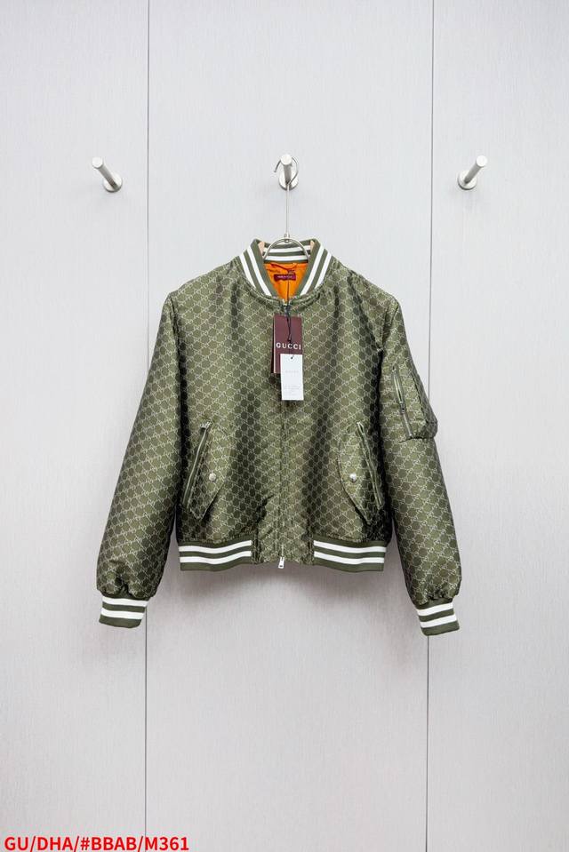 M361 Gugucc1 This long-sleeved, zip-up bomber jacket with a Gucci Double G all-o