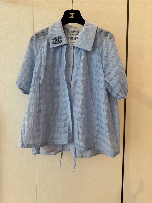 Cc Chane's new faux two-piece short-sleeved custom fabric features a delicate an