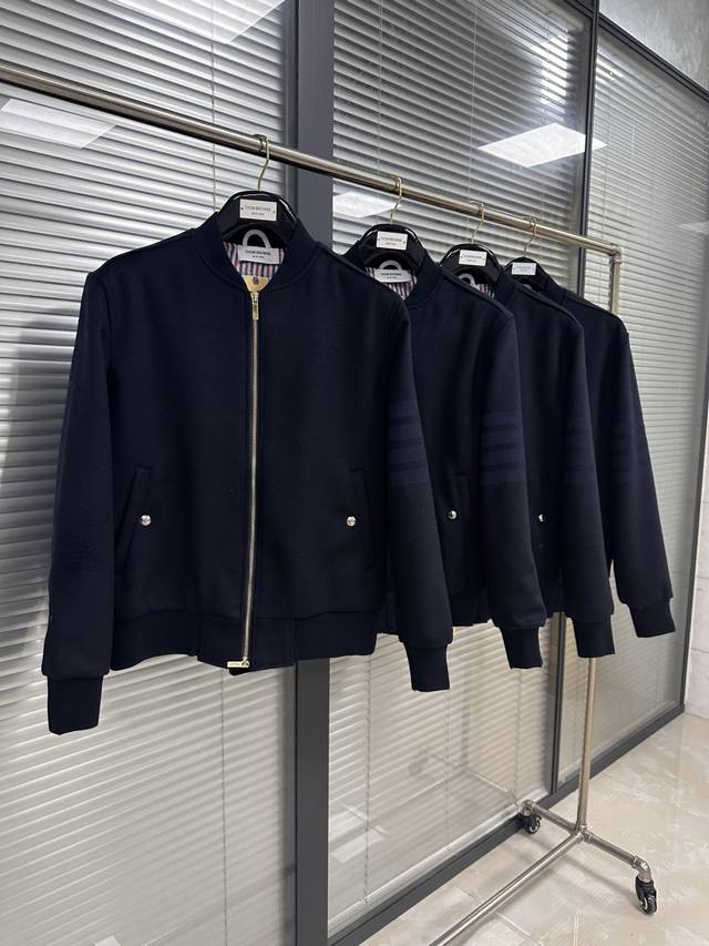 Yarn-dyed four-bar wool baseball jacket. Classic four-stripe design with gray st