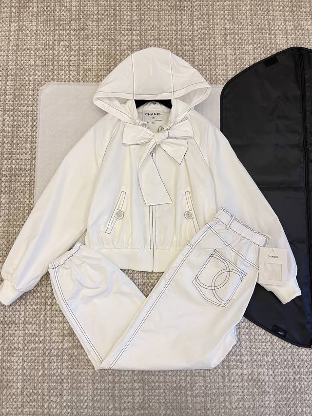 Chan'1 25 Coco Beach new arrival. Hooded jacket with a bow and ribbon detailing.
