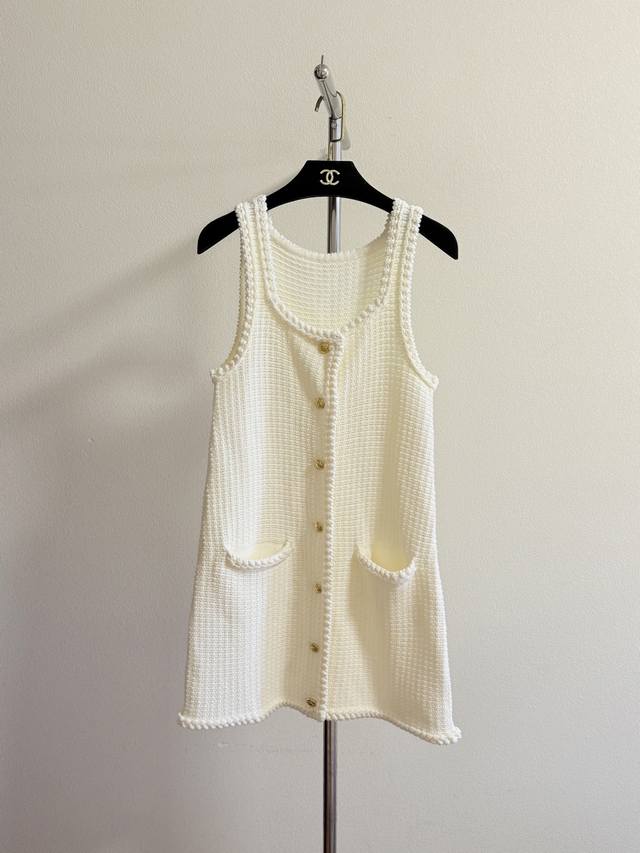 Celin's super pretty knitted dress is French romantic, with a milky apricot colo