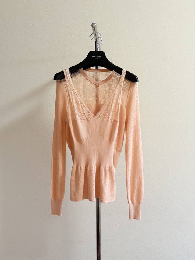 Chlo's elegant hollowed-out vest is super gentle. The orange-pink custom-dyed ya