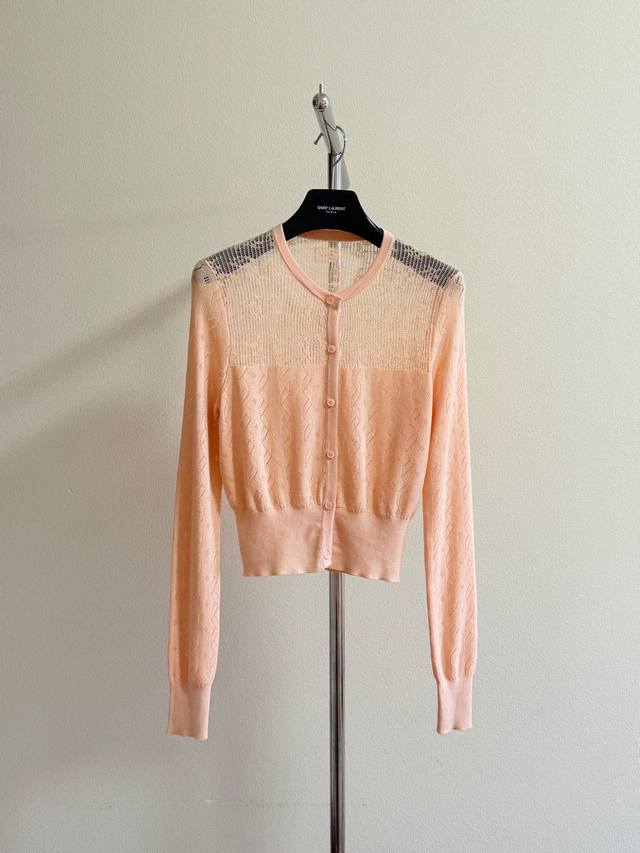 Chlo's elegant hollow cardigan is super gentle. The orange-pink custom-dyed yarn