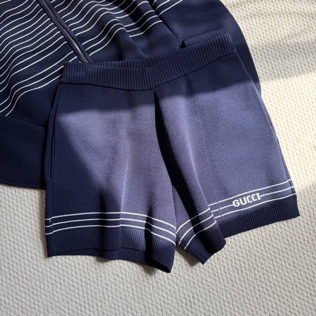 Gucc navy blue preppy shorts. Heavyweight beaded shorts with double pockets and