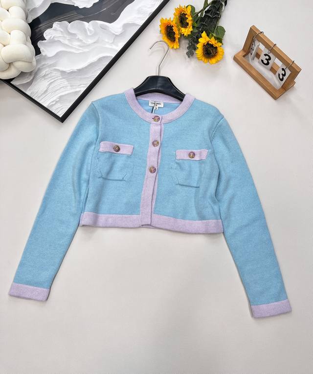 The classic Chanel style cardigan is back! The blue-green hue meets the macaron