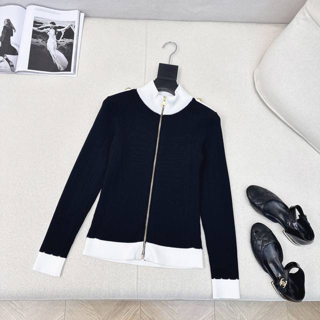 Bal 25Ss. This newest early fall design features a contrasting, stand-up collar
