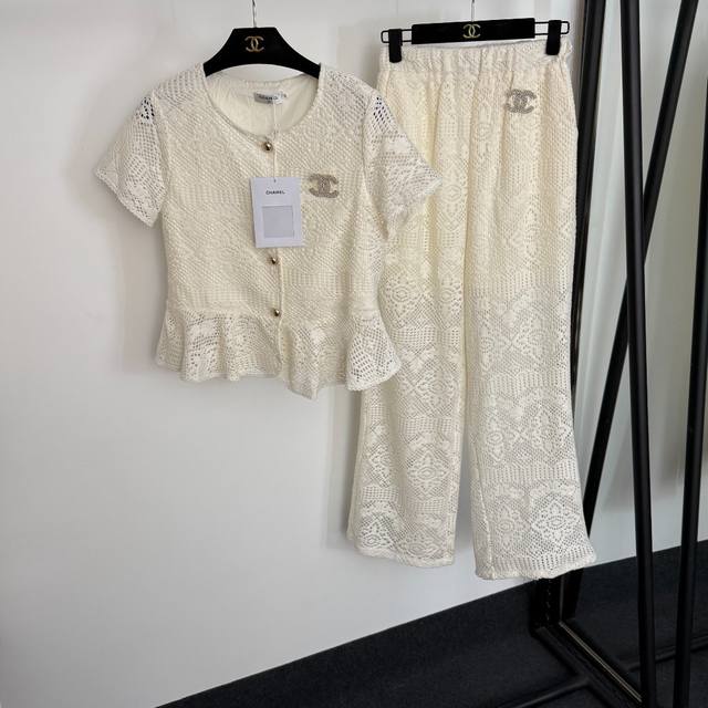 Style 20254443 Chane's newest set, featuring a Chanel logo brooch with ruffled,